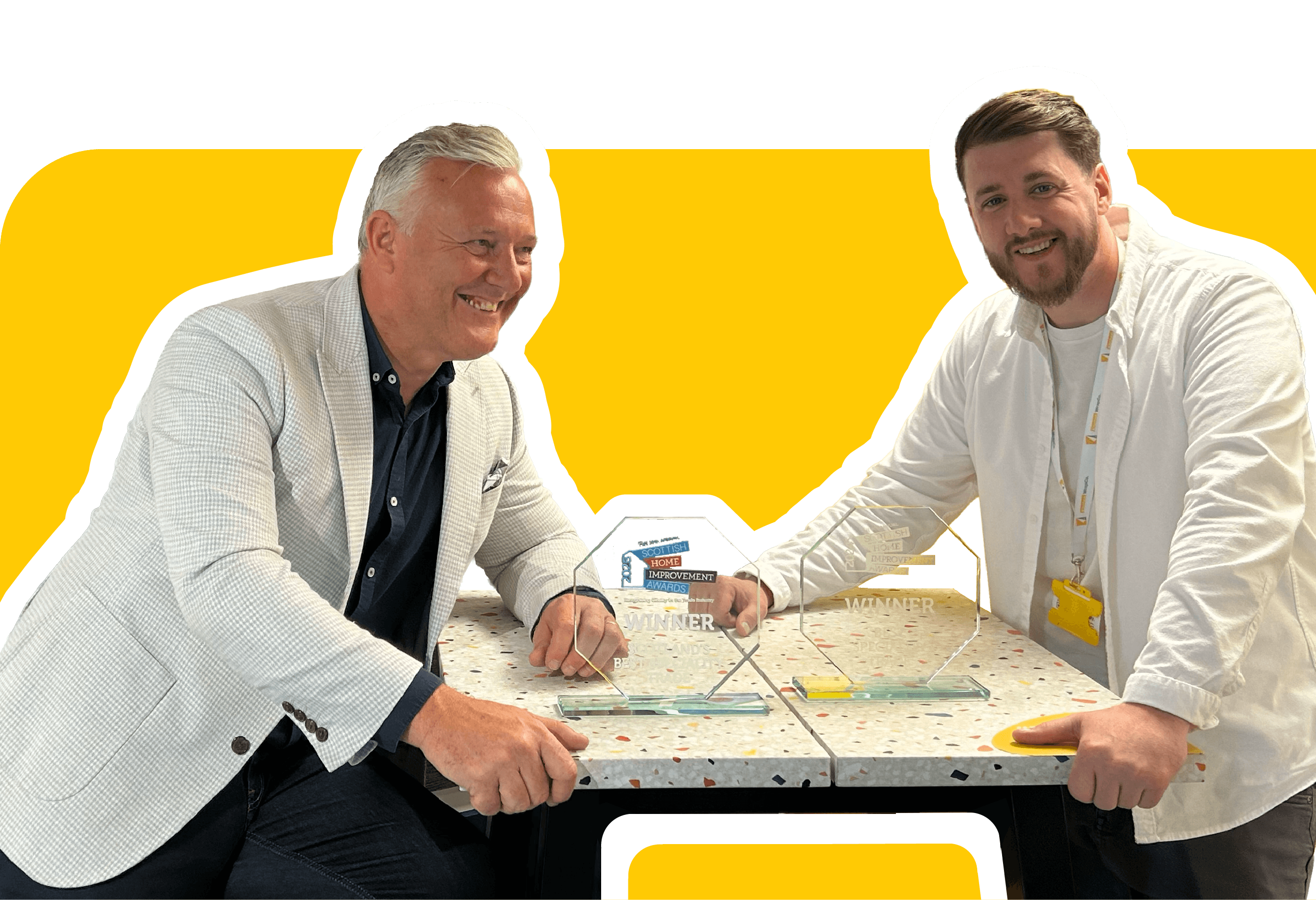 Warren and Daryl celebrating Kitchen WrapCo.'s Scottish Home Improvement Awards partnership